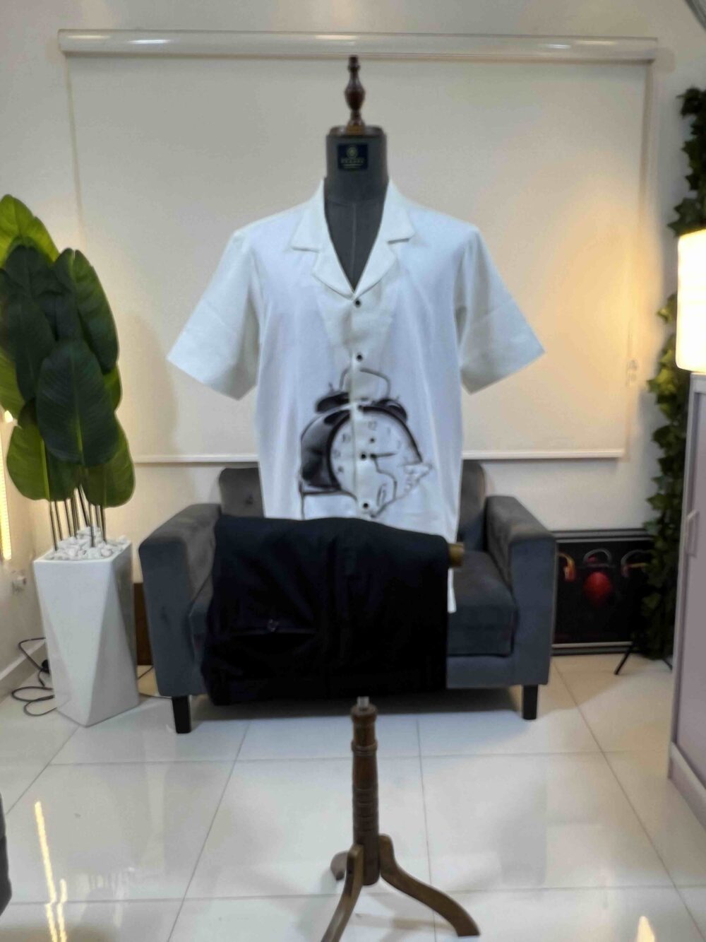 An off-white clock front detailed Kaftan