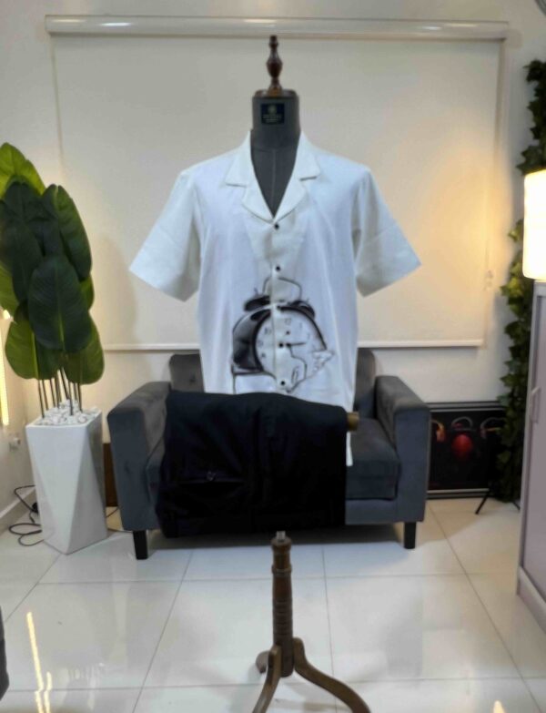 An off-white clock front detailed Kaftan