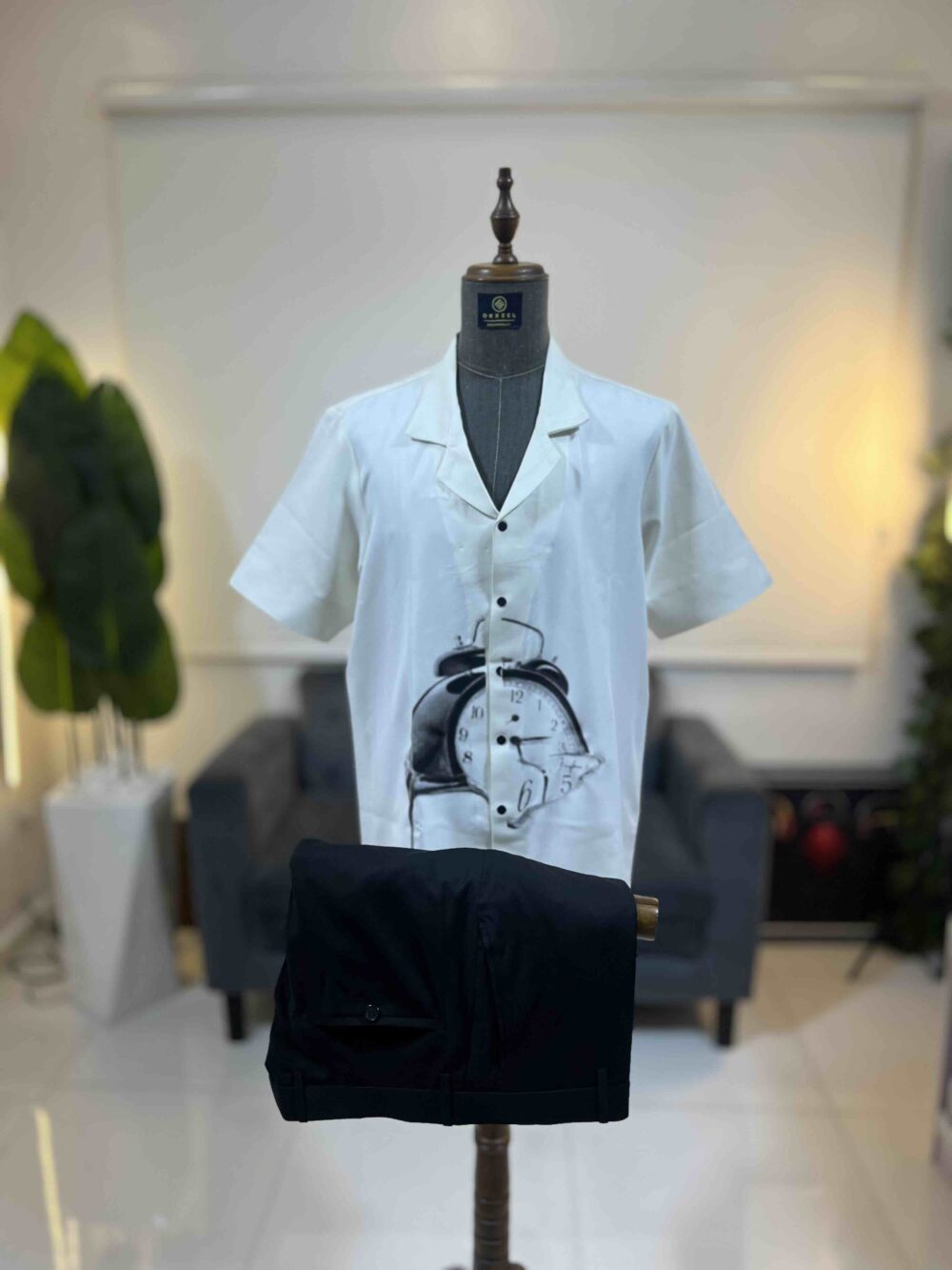 An off-white clock front detailed Kaftan