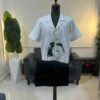 An off-white clock front detailed Kaftan
