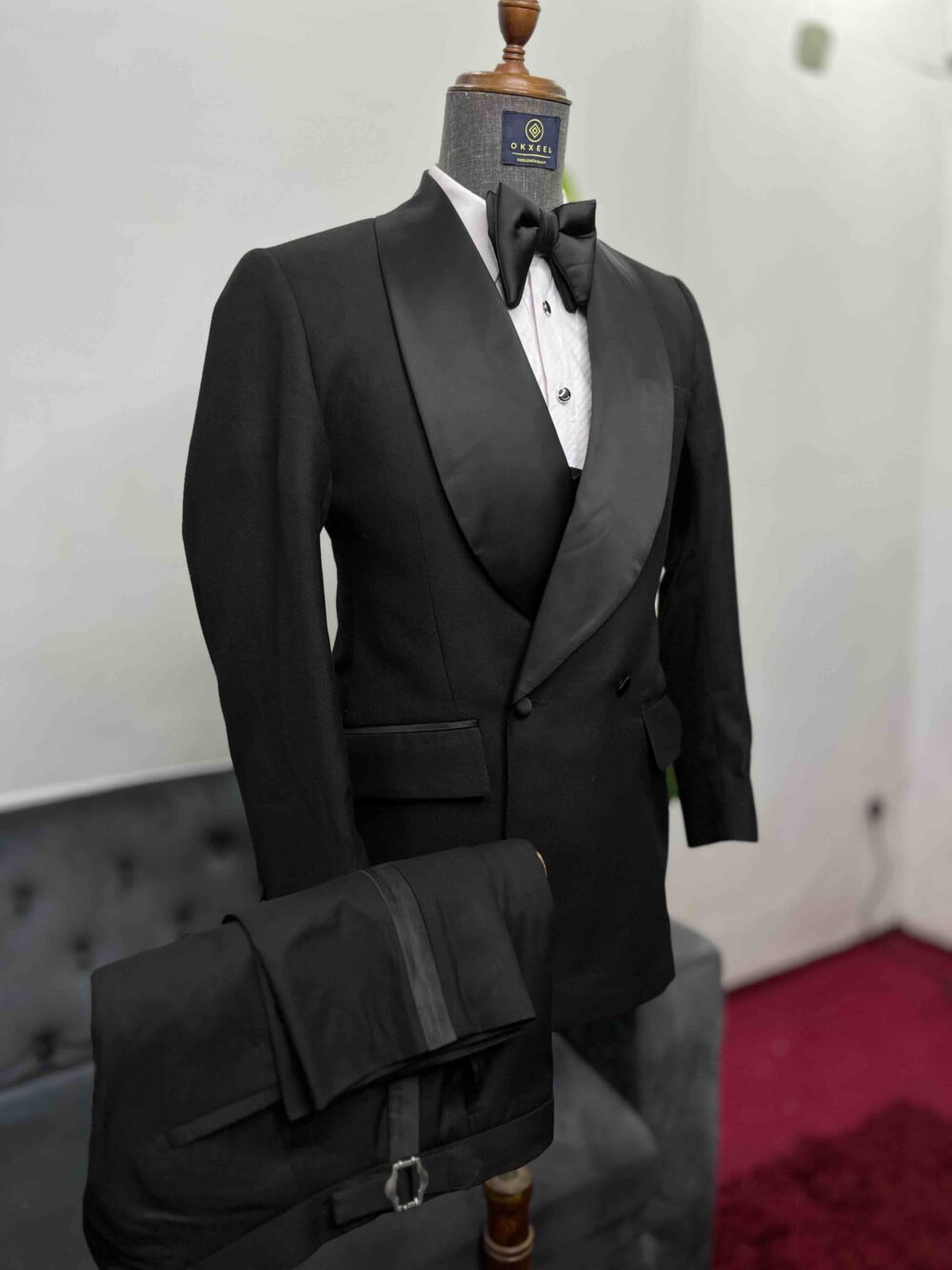 Black double-breasted shawl lapel suit.