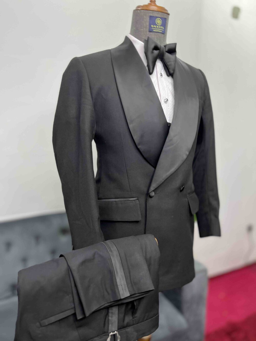 Black double-breasted shawl lapel suit.