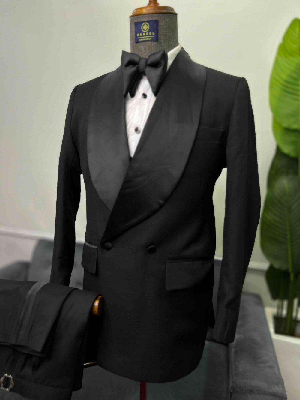 Black double-breasted shawl lapel suit.