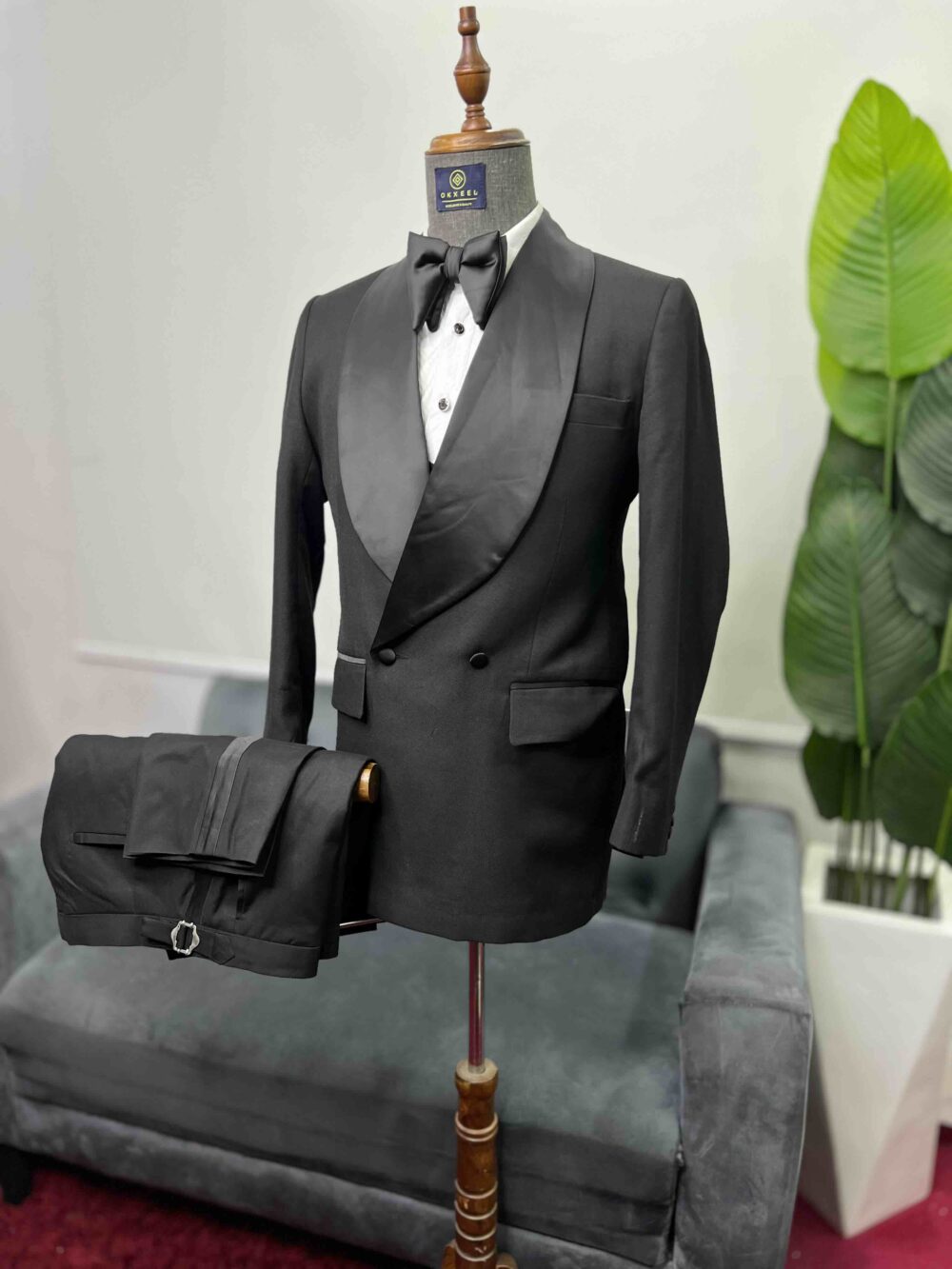 Black double-breasted shawl lapel suit.