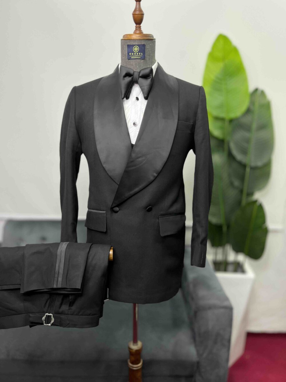 Black double-breasted shawl lapel suit.