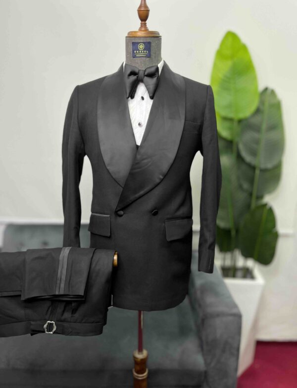 Black double-breasted shawl lapel suit.