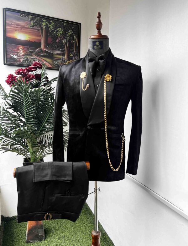 Black velvet tuxedo suit.